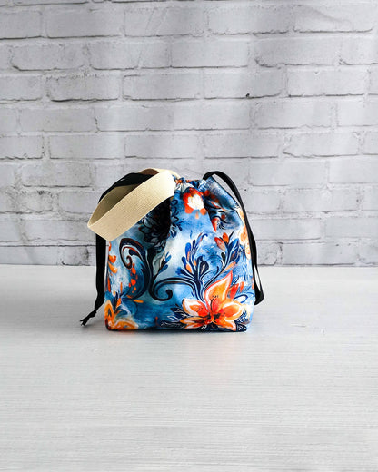Farbenfrohe Stricktasche mit blau-orangem Blumenmuster - handgenäht in bayern von Nadelmikado